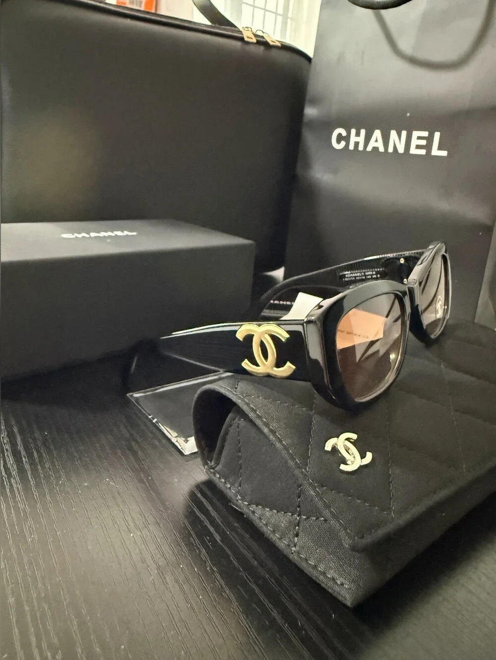 CHANEL Black Frame Sunglasses with Brown Gradient Lenses